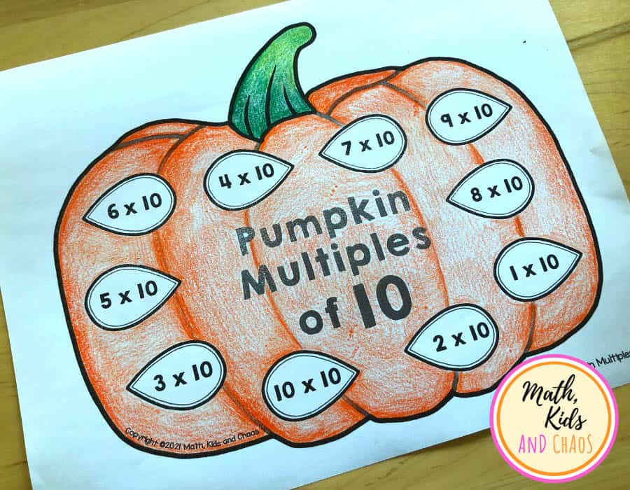 Coloured in pumpkin picture. Spaces on the pumpkin with multiplication questions for multiples of 10.